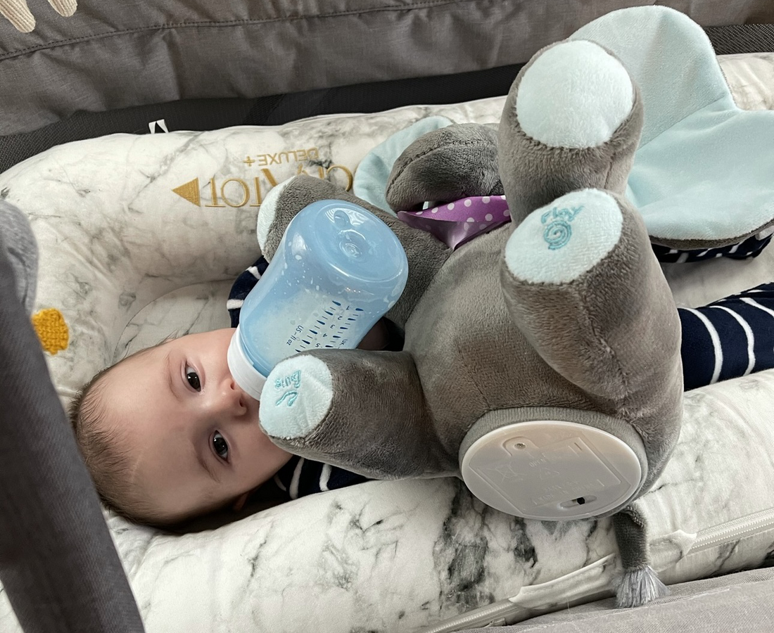 (Me using a plush toy elephant to hold up my son's bottle to get a tiny break)